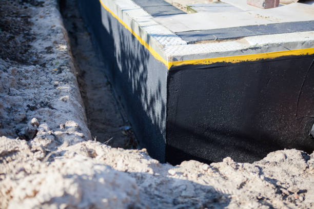 Professional Waterproofing technician working in Angola, NY